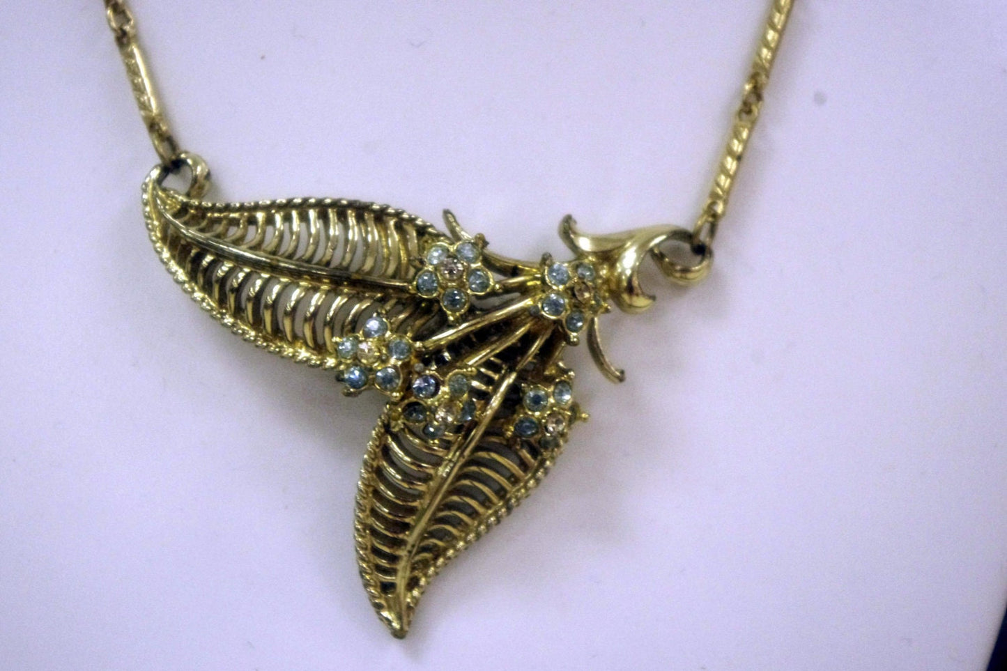 Art Deco Gilded Lavaliere Necklace with Blue Crystal Rhinestone Flower Pendant