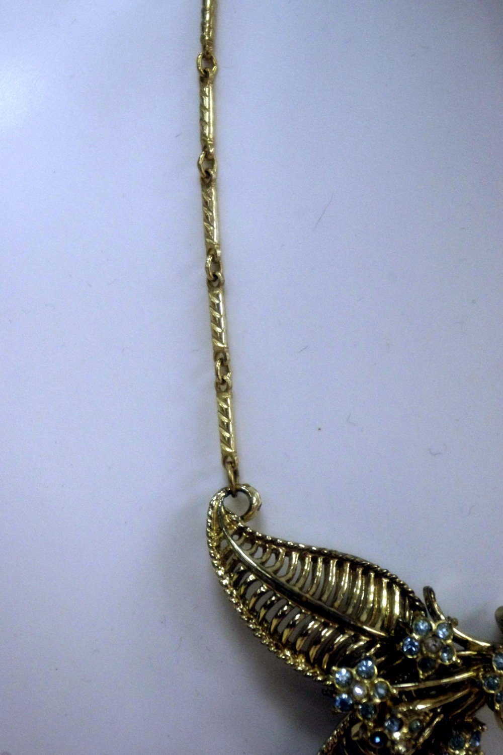 Art Deco Gilded Lavaliere Necklace with Blue Crystal Rhinestone Flower Pendant