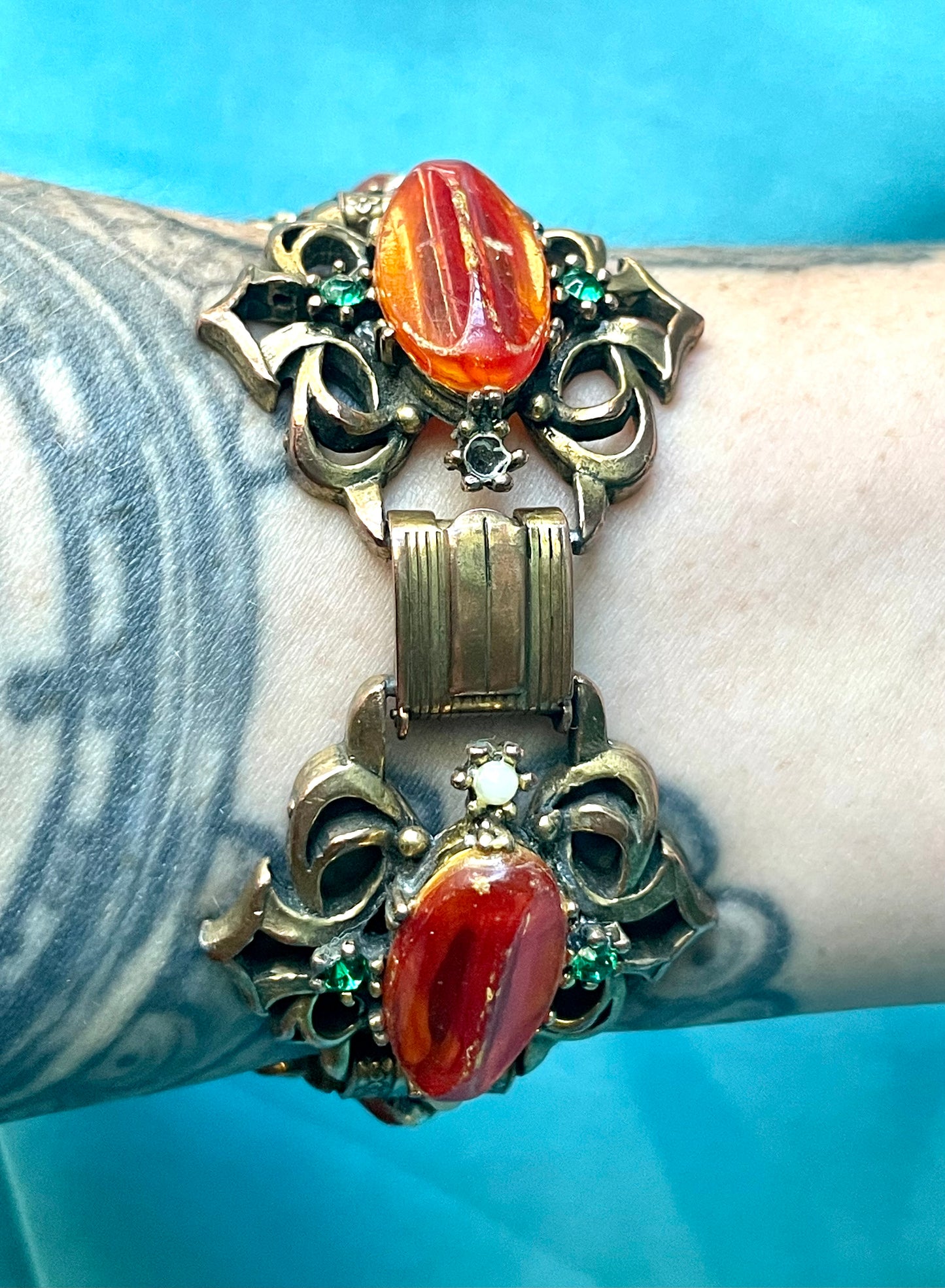 Heavy Brass Booklink Red-Orange Faux Amber Celluloid, Green Crystal & Pearl Panel Link Bracelet