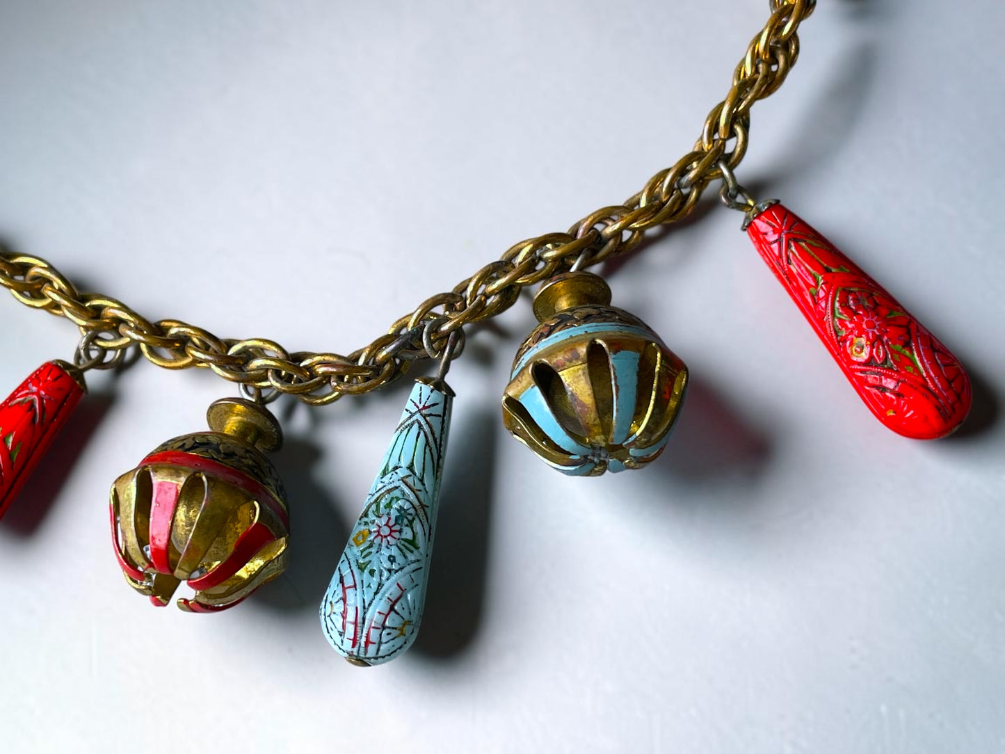 Art Nouveau Egyptian Painted Glyph Molded Art Glass & Bell Charm Necklace