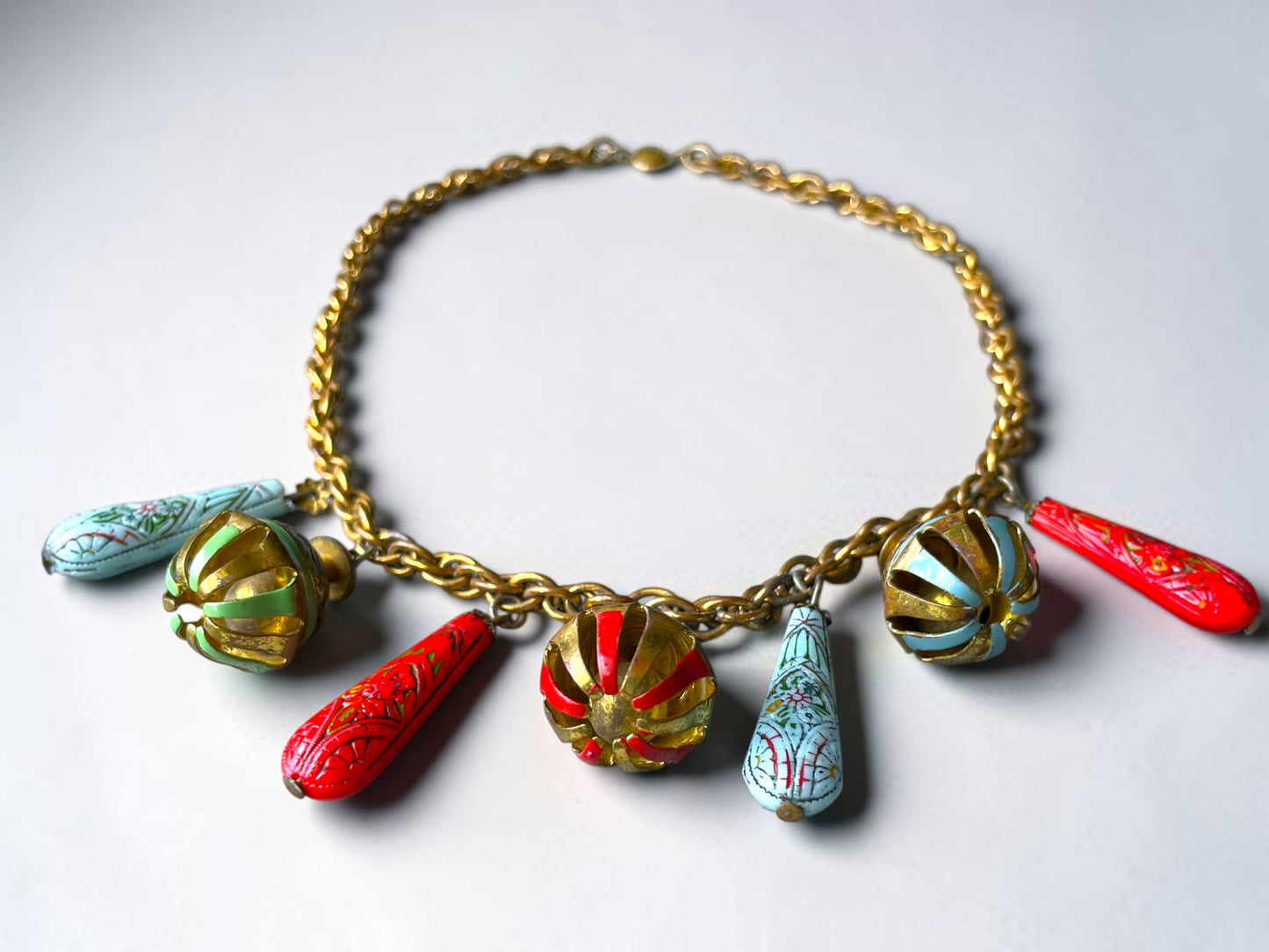 Art Nouveau Egyptian Painted Glyph Molded Art Glass & Bell Charm Necklace
