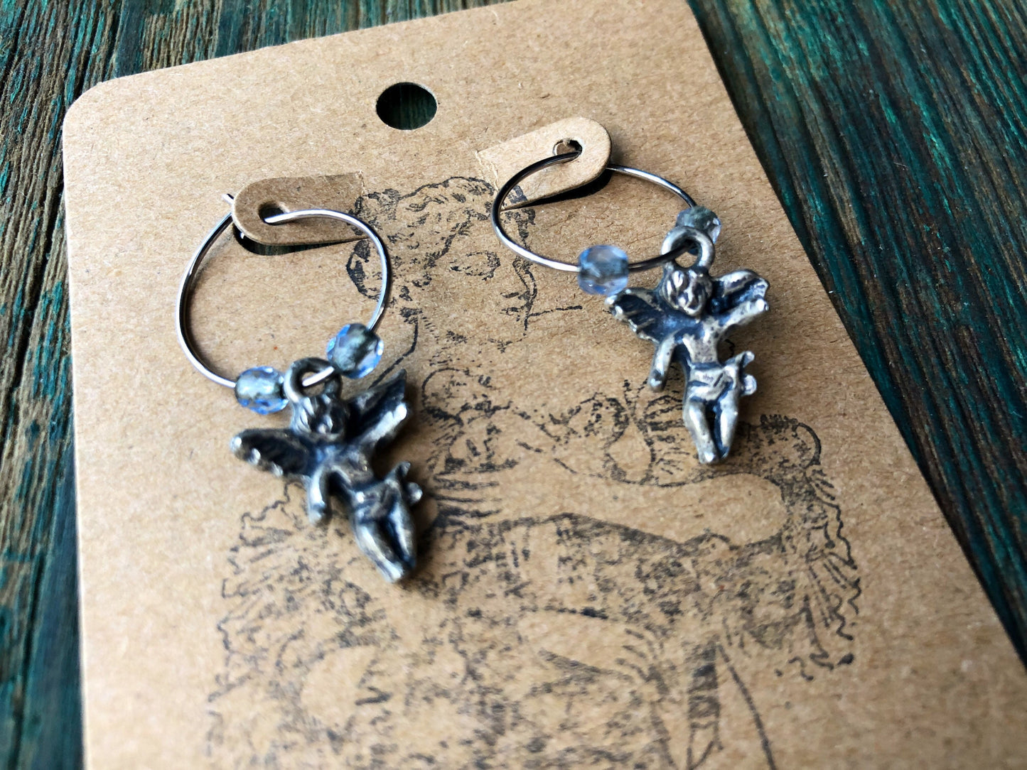 Sterling silver & blue topaz cherub angel hoop earrings