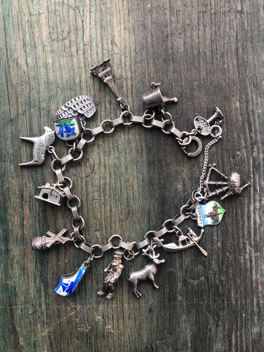 Vintage Sterling Silver Charm Bracelet with Windmill, Reindeer, Eiffel Tower, Bagpipes, Dutch Enamel Shoe, Champagne, Cabin & More