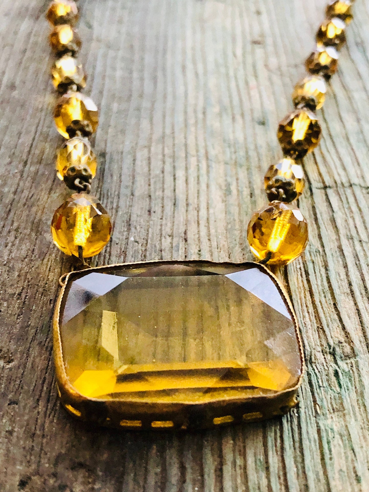 Antique Czechoslovakian Citrine Crystal Necklace with large Brass set center faceted stone and faceted crystal beads